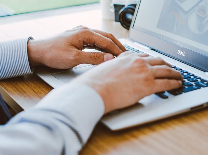 Man Using Dell Laptop